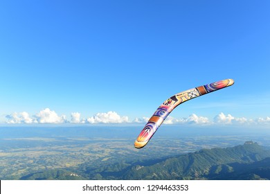 Wooden Boomerang With Blue Sky  Background.