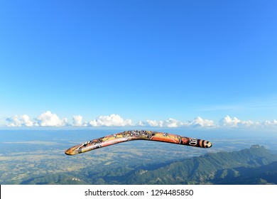 Wooden Boomerang With Blue Sky  Background.