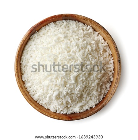 Wooden bowl of coconut flakes isolated on white background