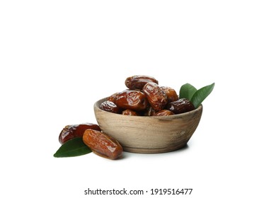 Wooden bowl of dates isolated on white background