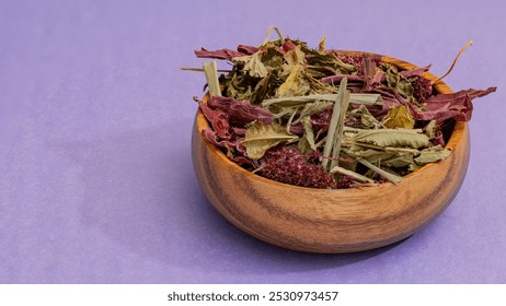 Wooden bowl filled with dried herbs for traditional Ecuadorian horchata tea, placed on a vibrant purple background. Ideal for promoting natural products, herbal remedies, or wellness teas. - Powered by Shutterstock