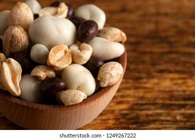 A Wooden Bowl Filled With Healthy Trail Mix