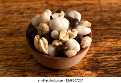 A Wooden Bowl Filled With Healthy Trail Mix