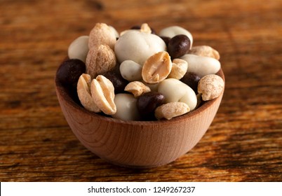 A Wooden Bowl Filled With Healthy Trail Mix