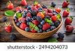 A wooden bowl filled with a variety of fresh berries, including strawberries, raspberries, blackberries, and blueberries, with sprigs of mint, sitting on a rustic wooden surface.