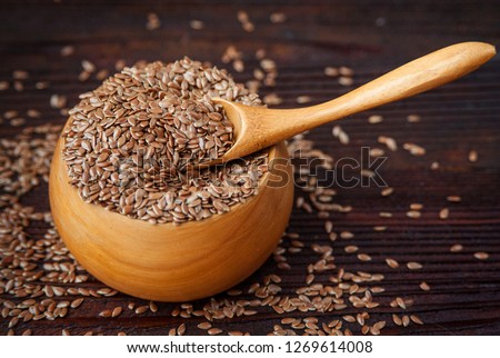 Wooden bowl with flax seeds