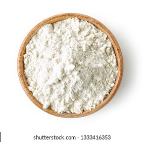 wooden bowl of flour isolated on white background, top view
