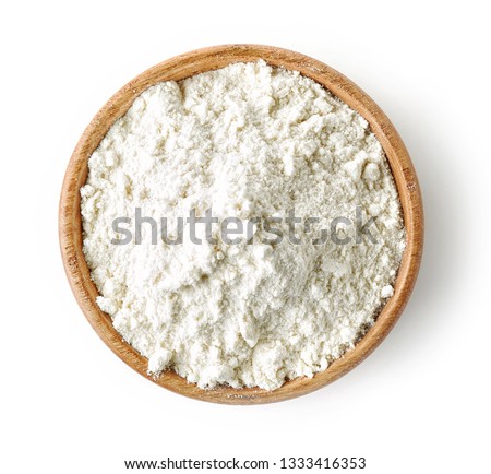wooden bowl of flour isolated on white background, top view