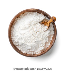 Wooden bowl with flour and flour spoon. Rice or wheat flour isolated on white background. top view - Shutterstock ID 1672490305