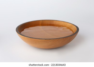 Wooden bowl full of water on white background - Powered by Shutterstock