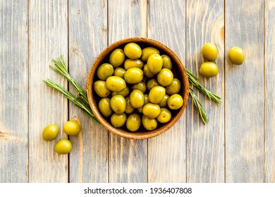 Wooden Bowl Of Pickled Green Olives, Top View