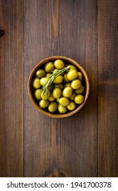 Wooden Bowl Of Pickled Green Olives, Top View