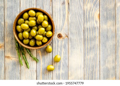 Wooden Bowl Of Pickled Green Olives, Top View