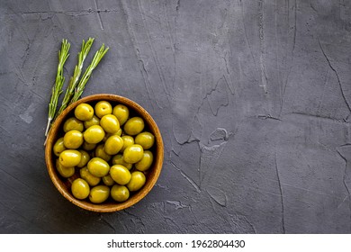 Wooden Bowl Of Pickled Green Olives, Top View