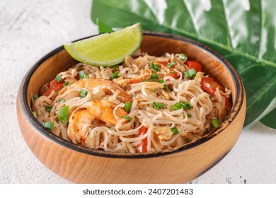 Wooden bowl of stir-fried pad thai dish - Powered by Shutterstock