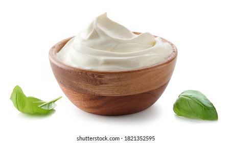 wooden bowl of whipped sour cream yogurt isolated on white background