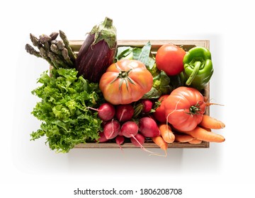 Wooden box with fresh vegetables, isolated from the white background. top view - Powered by Shutterstock