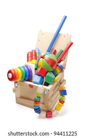 wooden box with many toys on white background