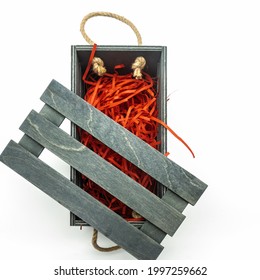 Wooden Box For Packing Gifts. Rope Handles. The Lid Is Wooden, Lattice. Filled With Bright Red Straws Inside. Isolated On A White Background. Top View