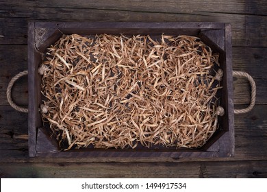 Wooden Box With Shavings Straw Filling On Table. Wine Bottle Crate. Top View.