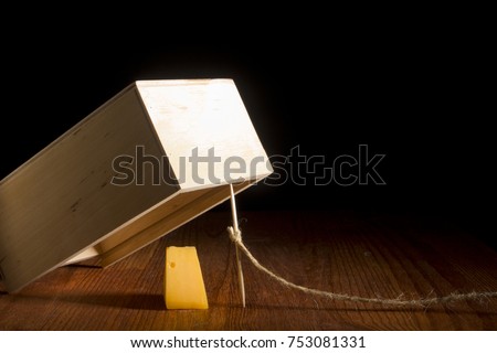 Wooden box as a trap on a black background