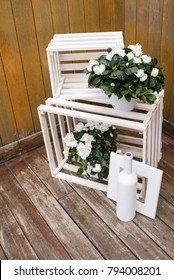 Wooden boxes wedding decoration. Vintage wedding composition with white flowers and wooden boxes