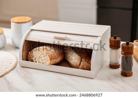 Image, Stock Photo A freshly baked loaf of bread with a beautiful crust lies on a cooling grid