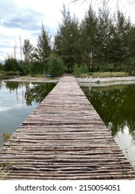 Wooden Bridge Above The Lake