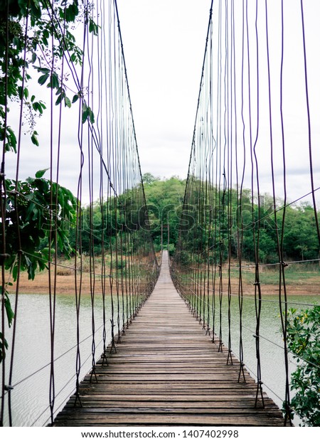 Wooden bridge across\
the river, Suspension bridge, Bridge in Kaeng Krachan National\
Park, Phetchaburi\
Thailand