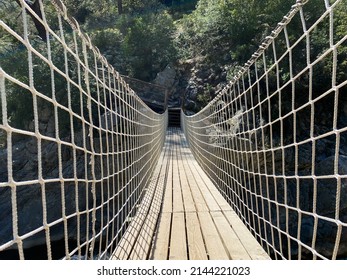 Wooden Bridge In Canyon With Net 