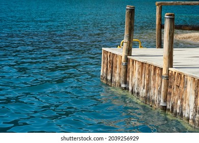 A wooden bridge extends into the sea. Selective focus. High quality photo