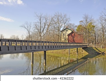 wooden bridge and historical homestead by the lake at 50 Point Stoney Creek, Hamilton Ontario Canada
