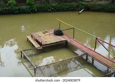 Wooden Bridge And Net Protection On Pond Or Lake