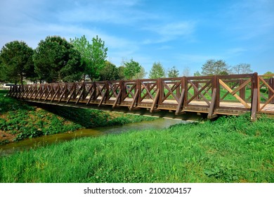 Wooden bridge, old small bridge made of wooden material by photo taken from its corner and blue sky background.