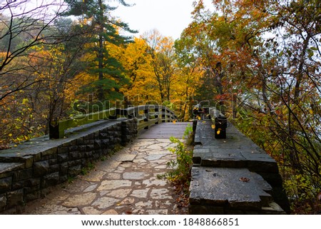 Wooden bridge on a cloudy Autumn morning.  Starved Rock State Park, Illinois, USA