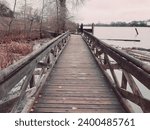 Wooden bridge on a fall season in Vancouver BC. Fraser River Park, Vancouver BC Canada.