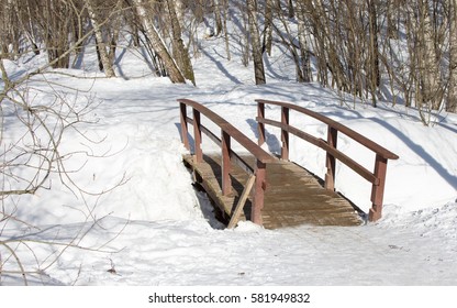 Wooden bridge in winter park