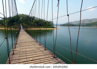 Wooden bridge with wire rope For a walk across the water island at the Kaeng Krachan Dam Petchburi Thailand.
