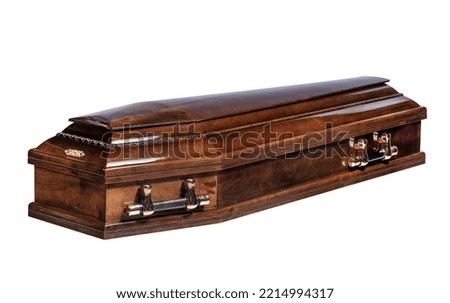 Wooden brown coffin with a closed lid with golden handles on a white background