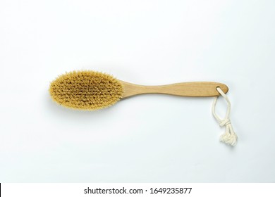 Wooden Brush For Body Dry Massage. Dry Wooden Cellulite Brush For Body And Foot Massage. Close-up Brush On White Background