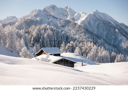 Wooden cabin or hut in the mountains in winter in the Austrian Alps.