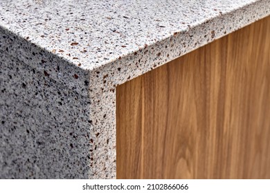 Wooden Cabinet Of Walnut Wood And Acrylic Solid Surface Countertop In Light Food Storage Room Of Apartment Extreme Close View