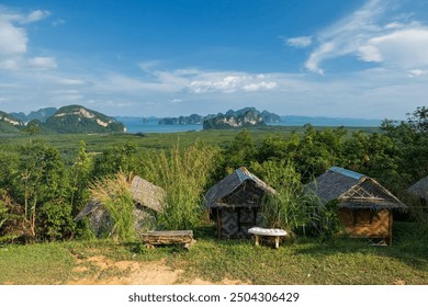 Wooden cabins at Samed Nang Chee mountain with Phang Nga bay view, Thailand. Famous travel destination or holiday vacation in tropical country, Siam. - Powered by Shutterstock