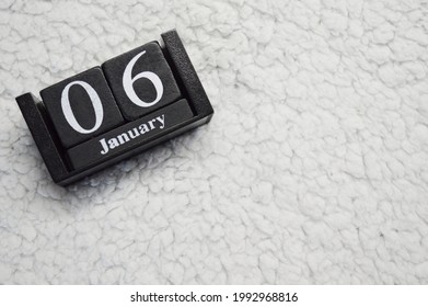 Wooden Calendar From Blocks On A White Textile Background With Copy Space. 6th Of January. Christmas Eve. Epiphany