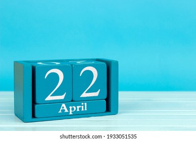 wooden calendar with date 22 april on blue wooden background, World Mother Earth Day (International Earth Day)