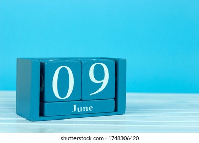 Wooden Calendar With The Date Of June 9 On A Blue Wooden Background, Coral Triangle Day, International Accreditation Day, World Pet Memorial Day, International Archives Day, International Friends 