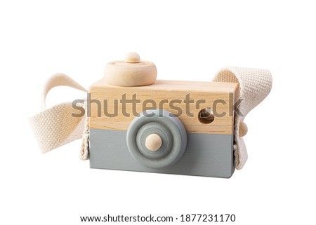 Wooden camera toy isolated on white background. Made from jackfruit wood.