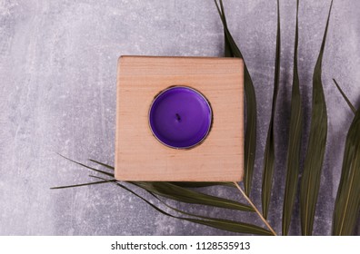 A Wooden Candlestick On The Table