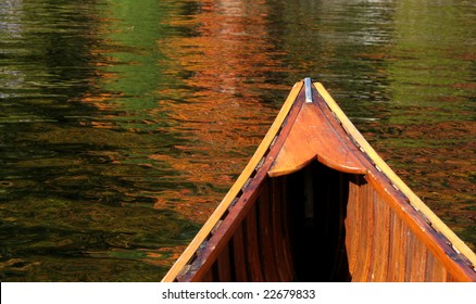 Wooden Canoe On A Lake In Autumn