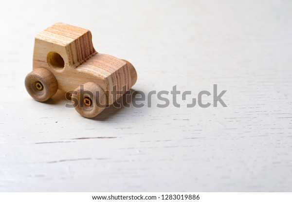 Wooden\
Car Handmade Toy on White Background, Copy\
Space